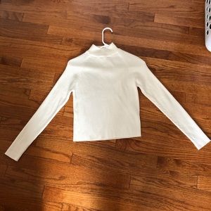Cream color petite long sleeve T-shirt.